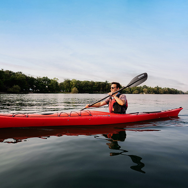 A person kayaking in the St. Lawrence River.